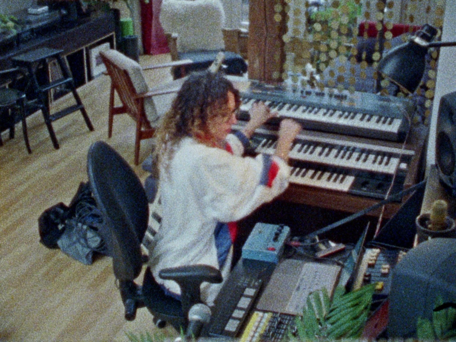 Still from the FFOSSO trailer: a woman working at a music studio